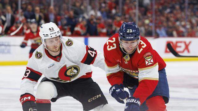 Florida Panthers center Carter Verhaeghe (23) takes the puck down the ice passed Ottawa Senators defenseman Tyler Kleven (43) during the third period of a game on Florida Panthers Pride Night on Tuesday, March 31, 2026, at Amerant Bank Arena in Sunrise, Fla. The Florida Panthers won 6-3. 